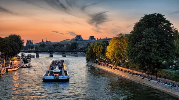 boats cruise down the Seine
